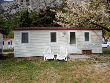 Outside a two-bedroom caravan