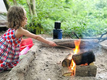 Toasting marshmallows on the campfire at wild boar wood campsite