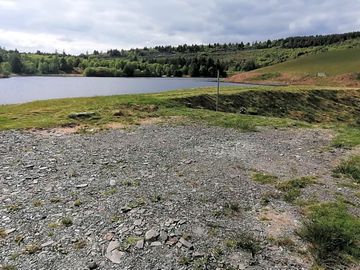 Our camper van pitch located just a stones through from our lake, swim and paddle to your hearts