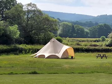 Echo bell tent exterior - echo has lovely views of the blackdown hills