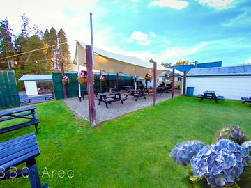 Barbecue area with picnic benches