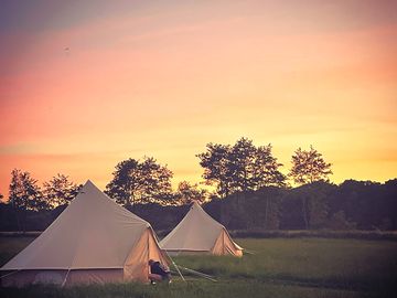 Sunset over the bell tents (added by manager 15 jul 2021)