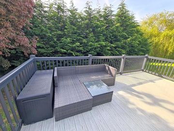 Lodge decking area with outdoor furniture