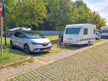 Visitor image of the pitch with a car space