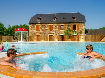 Swimming pool and hot tub with a view of the reception building