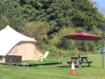 Shaded picnic bench by each bell tent (added by manager 20 apr 2023)