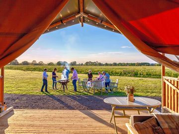 Open the tent to bring the outside in