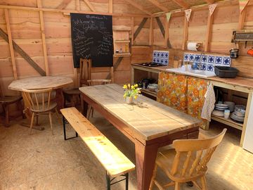 Field kitchen made from local, sustainable wood with a fridge and charging points (added by manager 29 jun 2022)