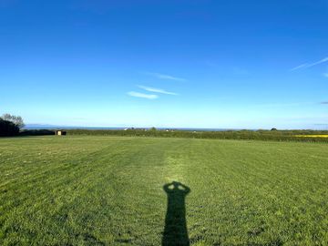 Lovely big open flat field, giving campers plenty of space and room with views over the channel. (added by manager 09 may 2024)
