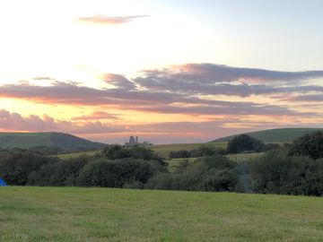 View of corfe castle from the camp site field (added by visitor 14 jun 2021)