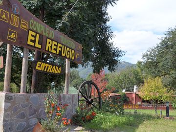 Site entrance with a mountain backdrop