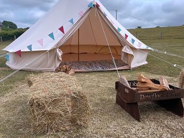 The classic 5 m bell tent complete with fire pit and bales, bunting and fairy lights. easily sleeps (added by manager 22 jul 2022)
