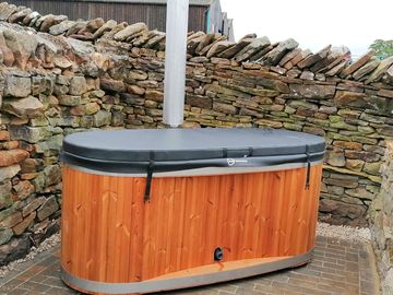 Wood-fired hot tub on private patio