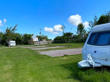 Hardstanding touring pitch with grass surrounds