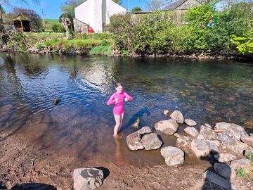 Young explorer enjoying a sunny day by the river irt