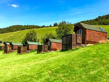 Pods with a hilly backdrop (added by manager 30 aug 2023)