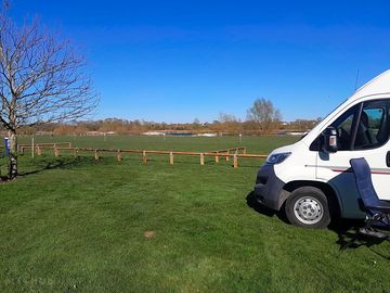 Flat grassy pitches & lakeside views