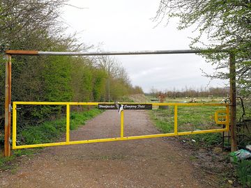 Yellow entrance gate, code to open padlock sent prior to arrival. height barrier open by request