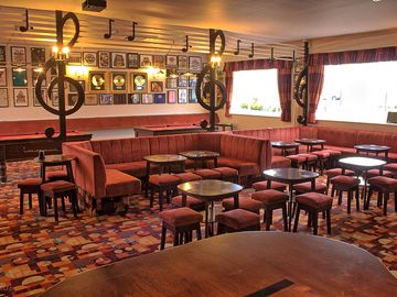 Family bar with guitar-shaped bar and music memorabilia