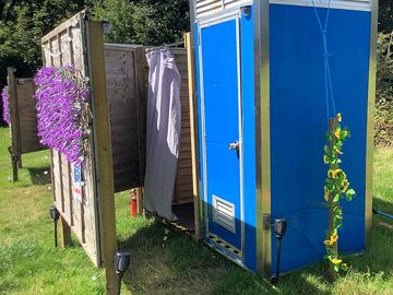 Outdoor hot showers and flushing toilets