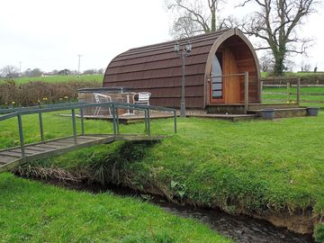Entrance to the pod is over a stream
