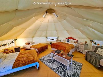 Interior of bell tent set up ready for 4 guests
