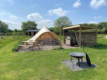 Family bell tent with private out door kitchen and fire pit.