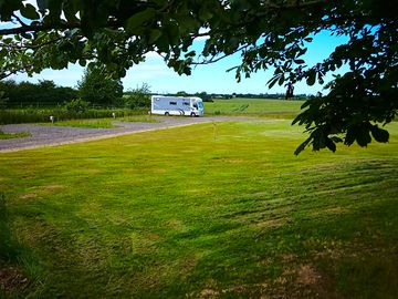 Looking down the site, through the trees