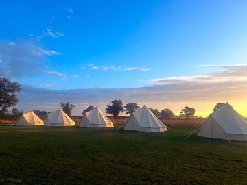 Beautiful sunrise looking over our luxury bell tents