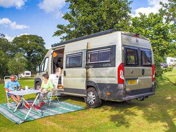 Campervan on the all-weather pitch with astroturf