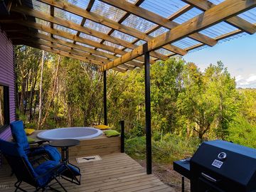 Covered terrace with hot tub and grill