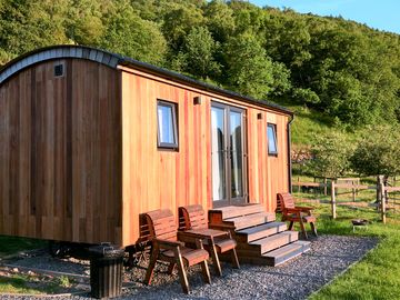 Exterior of the woolly wagon with outdoor seating area and enclosed garden (added by manager 12 jan 2024)