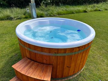 Wood fired hot tub included with bell tent