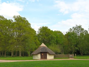Roundhouse backed by trees