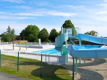 Heated pool with waterslide