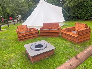 Bell tent with firepit and seating area