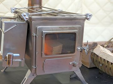 Log burner in the bell tent to keep us toasty warm!