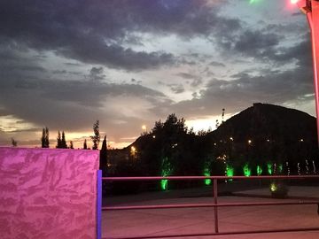 The site lit up at night