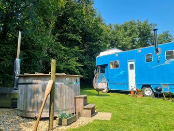 The wood burning hot tub sits next to big blue (added by manager 27 aug 2021)