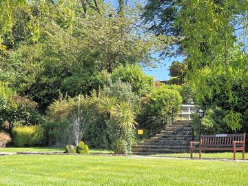 Water fountain and benches in the gardens
