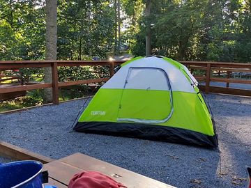 Tent site surrounded by trees