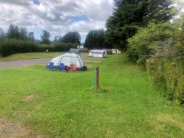 Electric hard standing and grass touring pitch