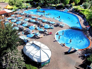 View over the swimming pool, paddling pool and sun terrace