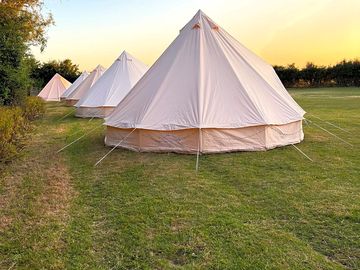 Bell tents, accommodate up to 5 people.