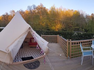 Each bell tent has a deck with seating and barbecue