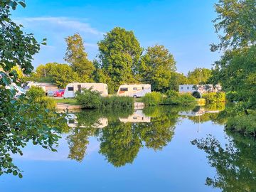 View of waterfront pitches from the other side of the lake (added by manager 14 sep 2022)