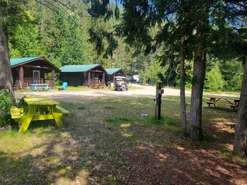 Full service tent site with 15 amp power, water, picnic table, and firepit