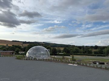 Our sky viewing dome, to look at the night skies. with the rolling welsh hills behind.