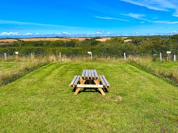 Large pitch with picnic table
