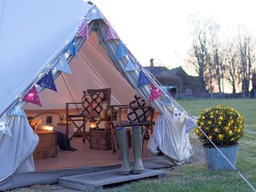 The tents have solar fairy lights, along with candle lanterns inside